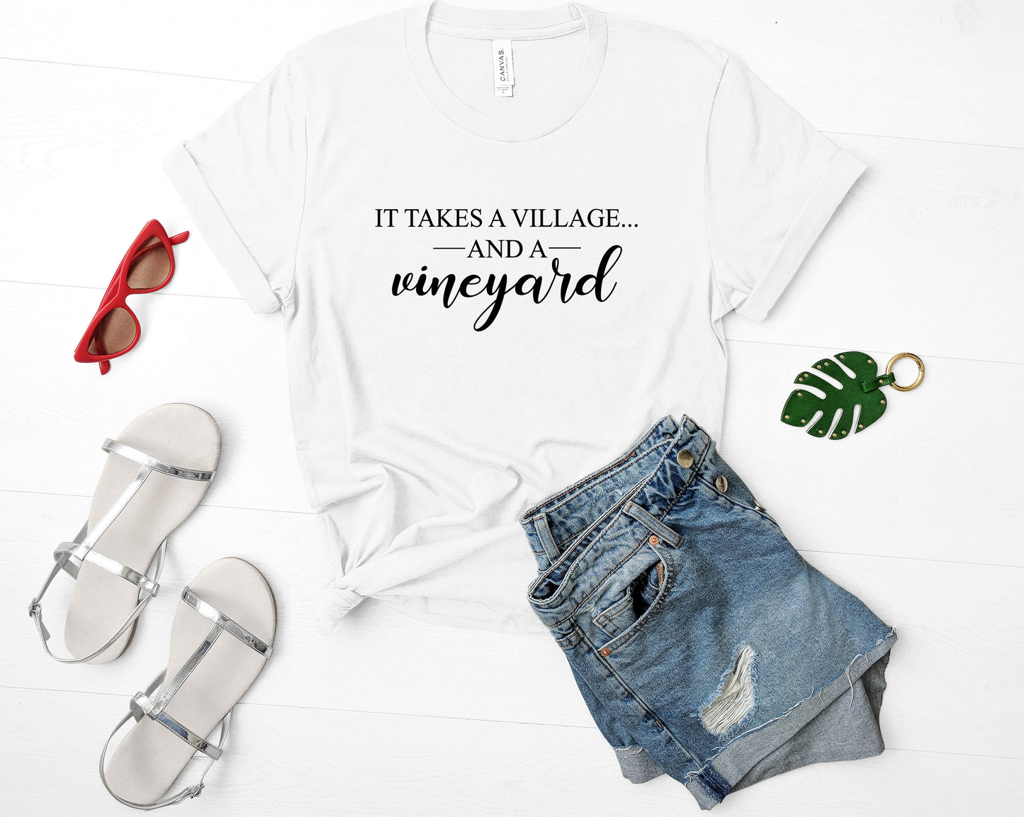 It Takes a Village Bella+Canvas Premium Graphic Tee