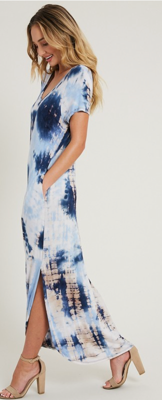 side facing model wondering if she stepped on an ant