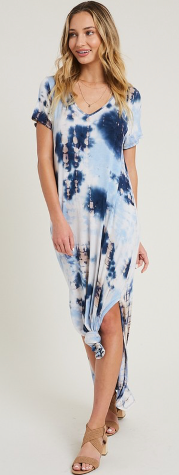 model facing backward wearing tie dye dress